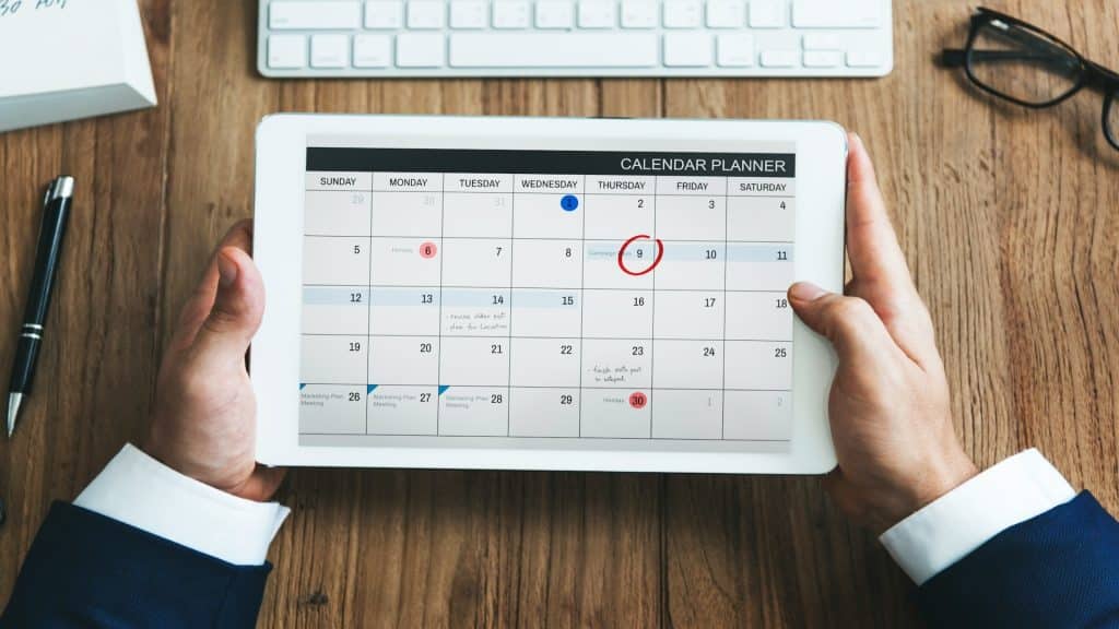 man reviewing shared calendar