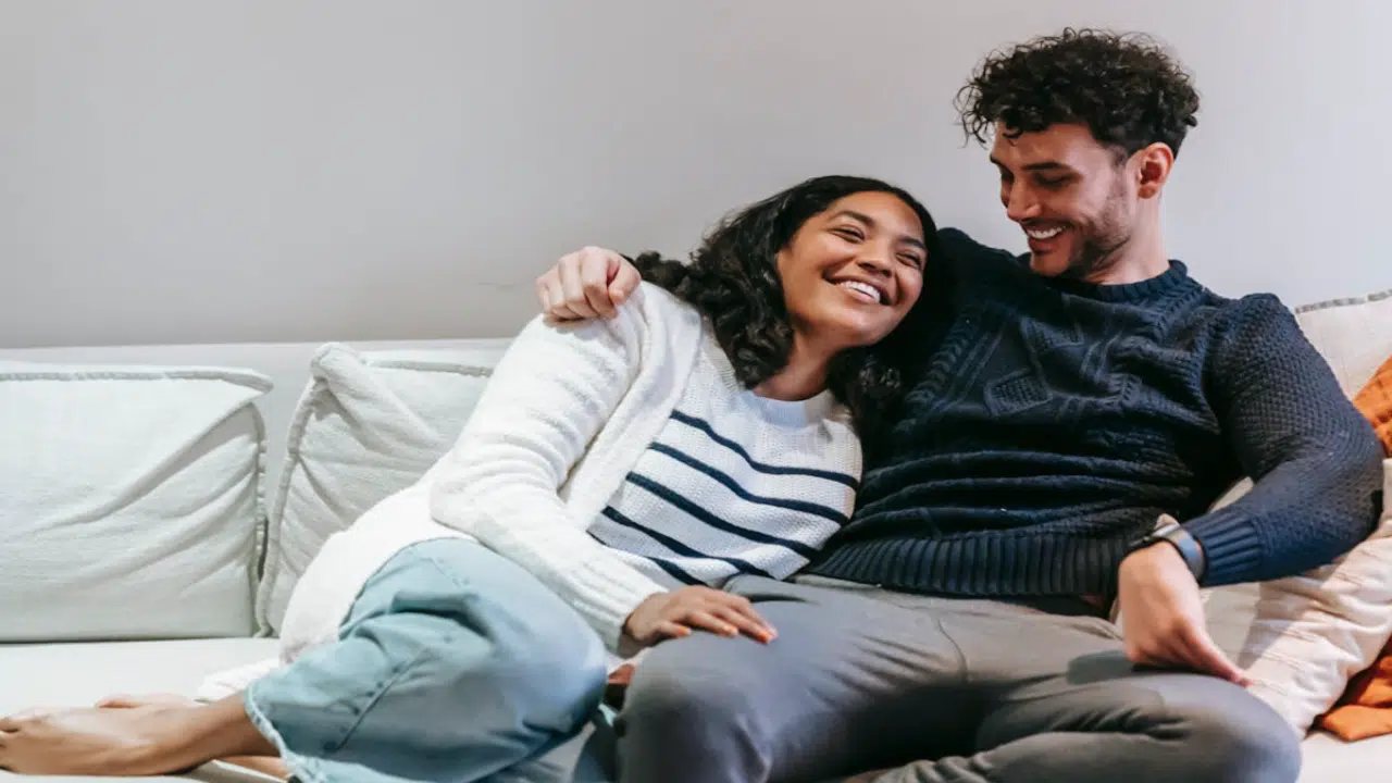 A couple smiling while talking