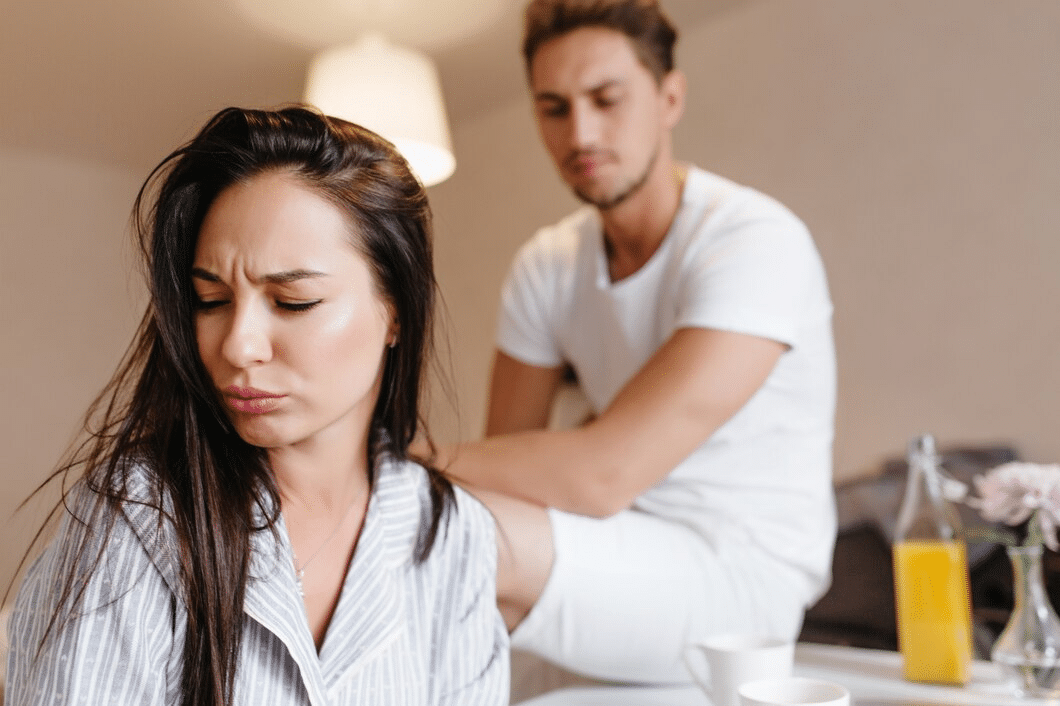 Upset woman turned away from her boyfriend