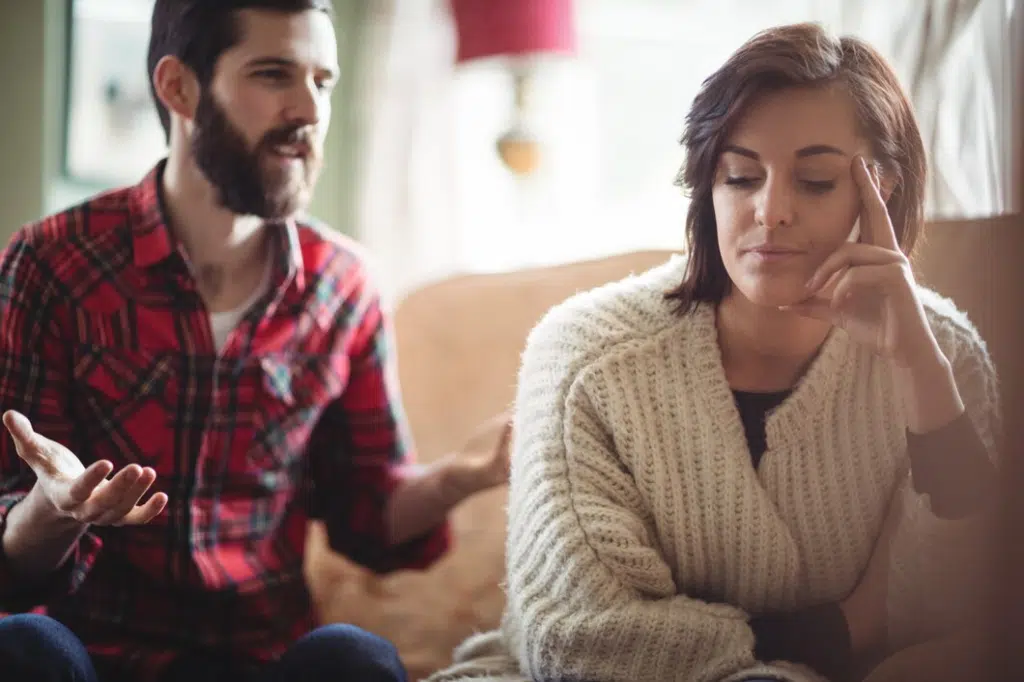 Couple arguing with each other in living room