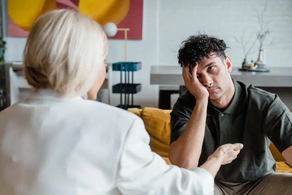 Man bored and unattentive talking to woman