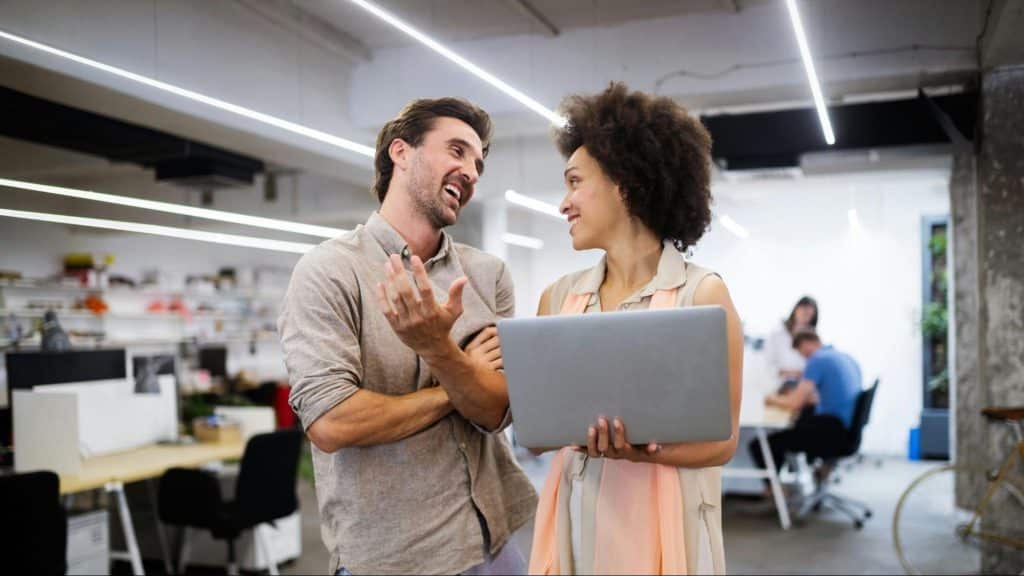 A man and woman talking about work