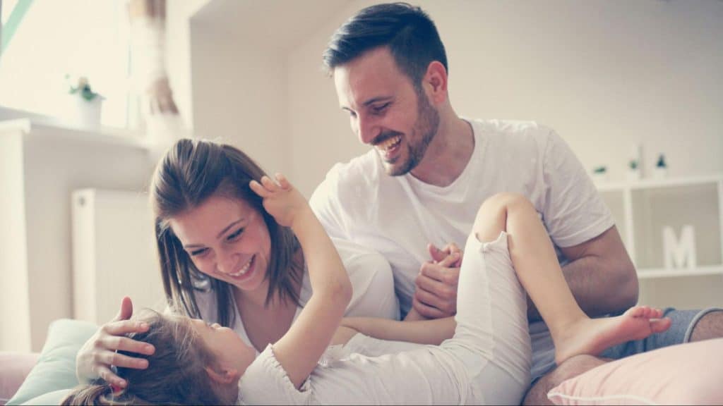 A man and woman with their child 