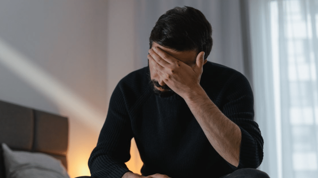 A man looking sad at home