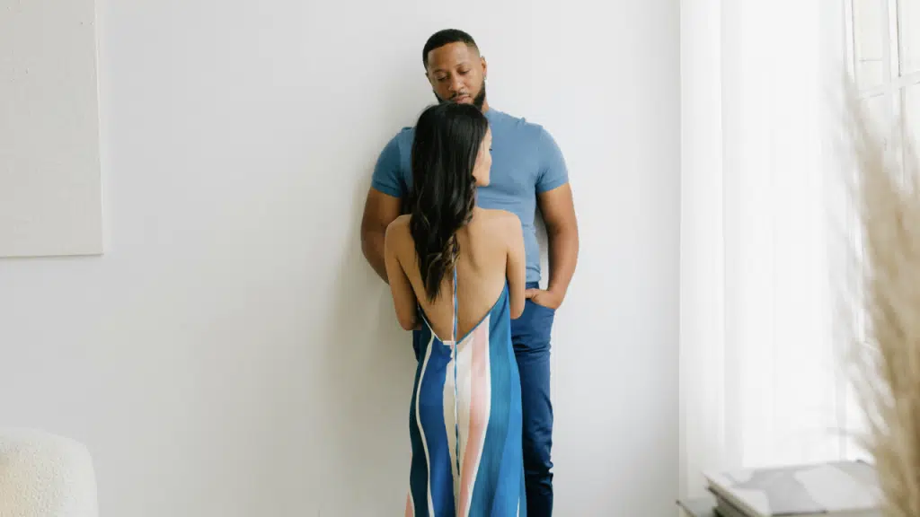 A couple looking sad at home