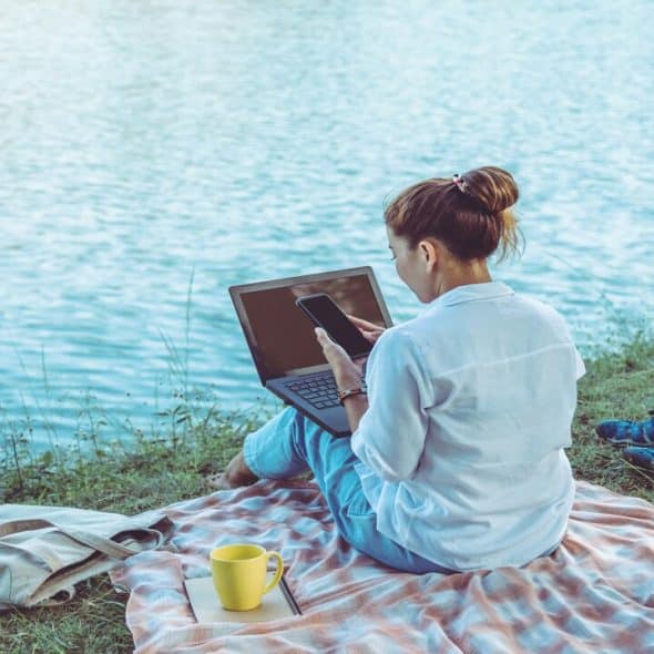 A woman having alone time by the water