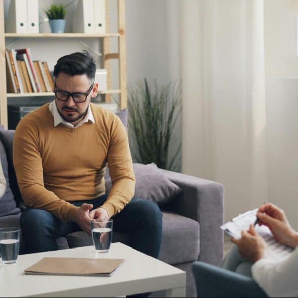 A woman talking to a man