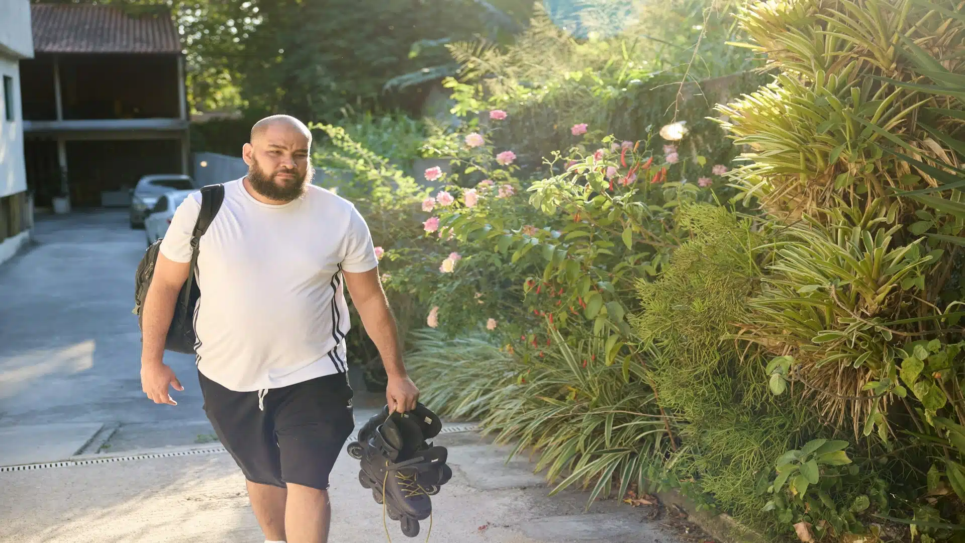 man walking thoughtfully outdoors