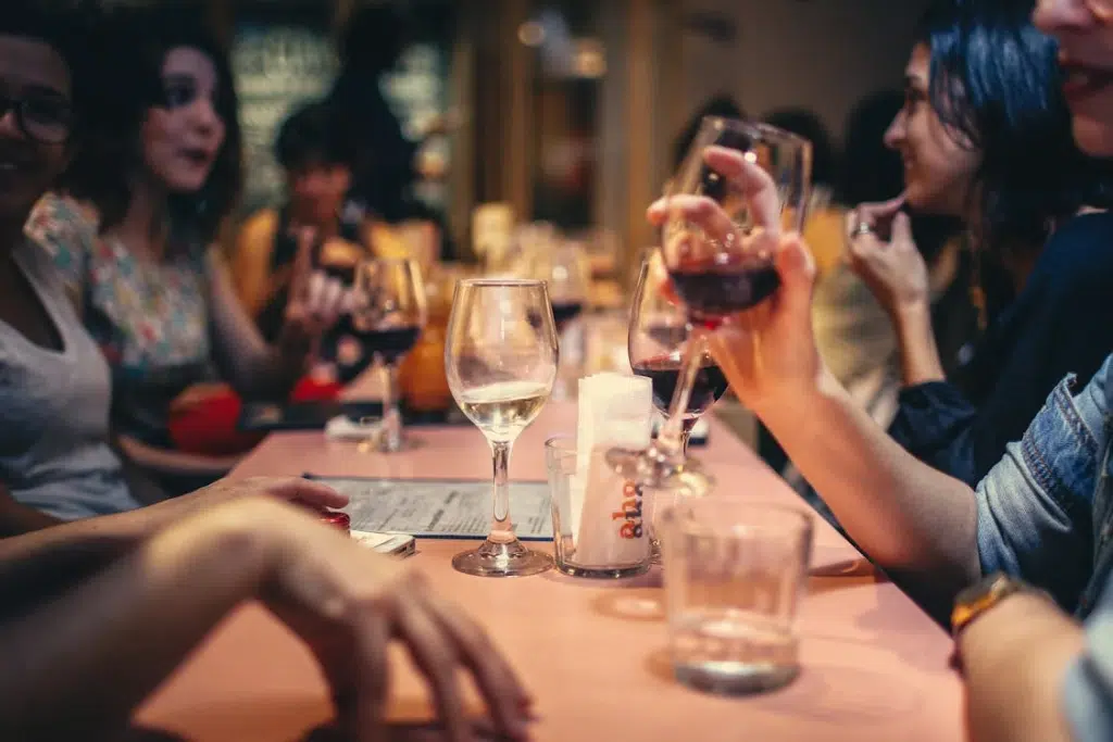 People drinking wine at the table