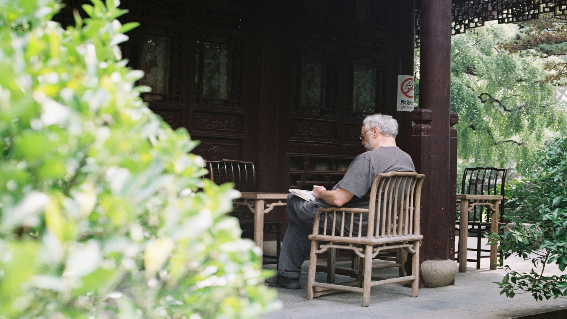 man sitting quietly during conversation