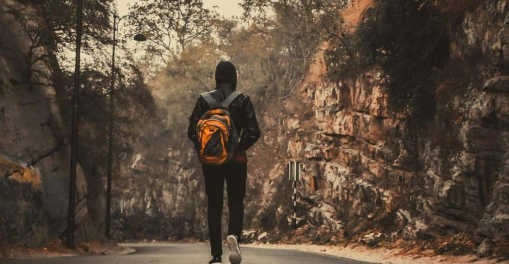 thoughtful man walking alone