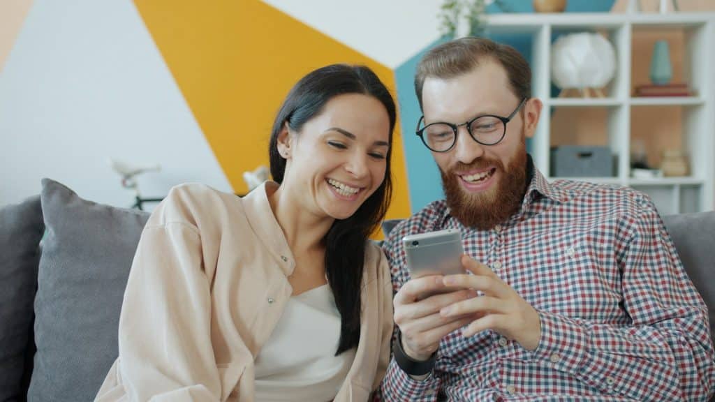 couple smiling indoors
