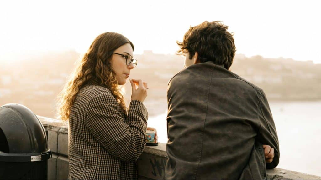 A man and woman talking casually