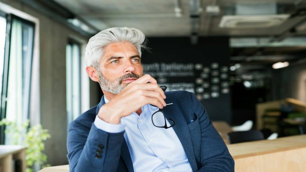 man thinking during conversation