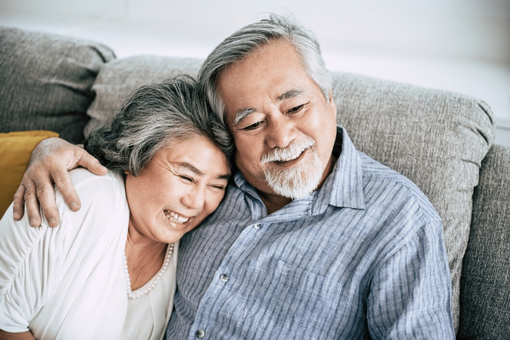 Senior couple playing together at living room