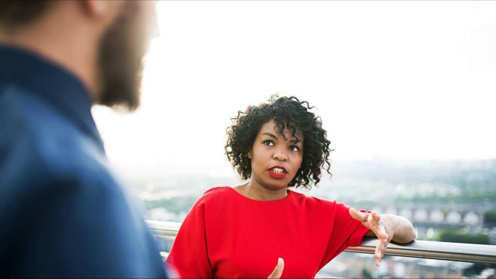 A woman talking to a man