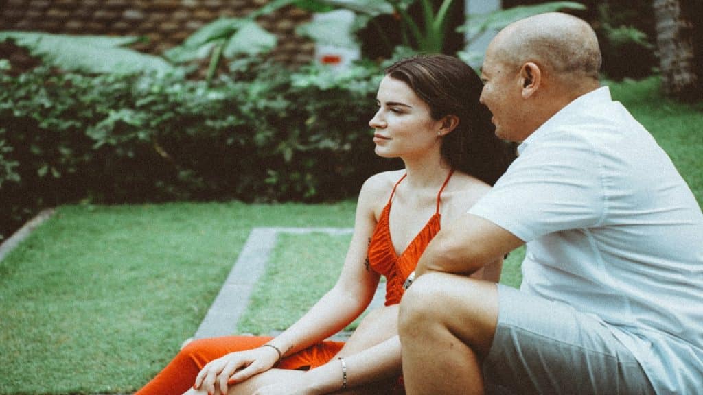 man sitting calmly with partner