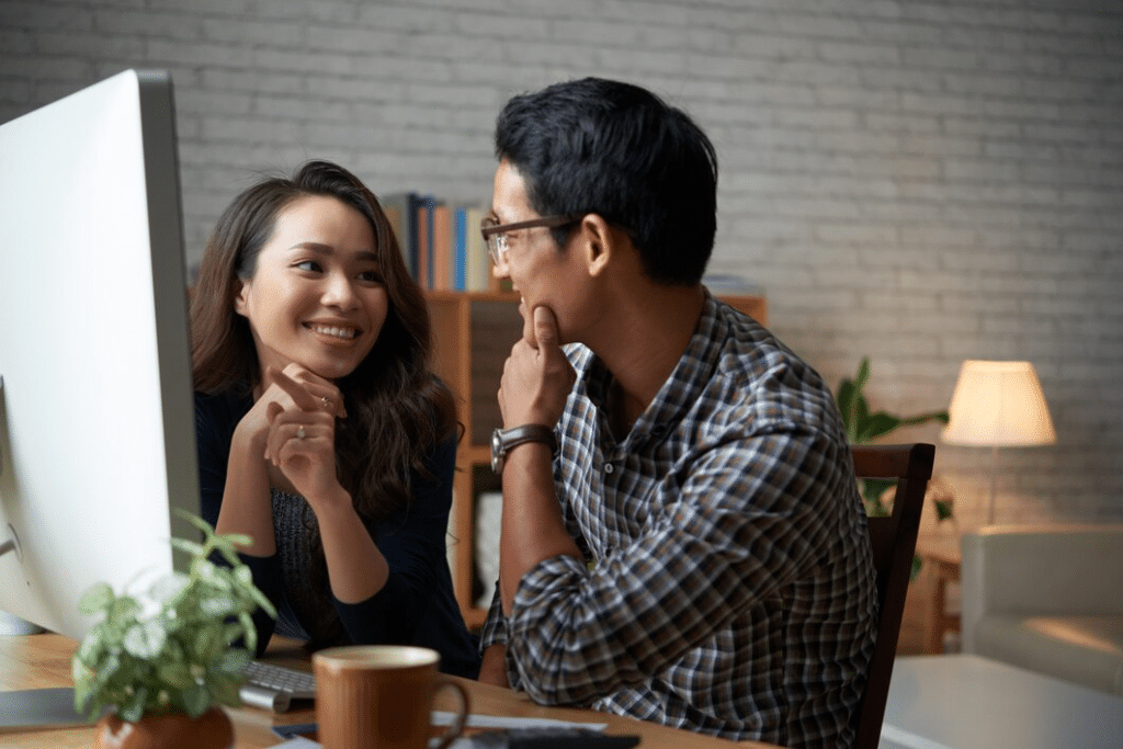 Two people looking at each other in cafe