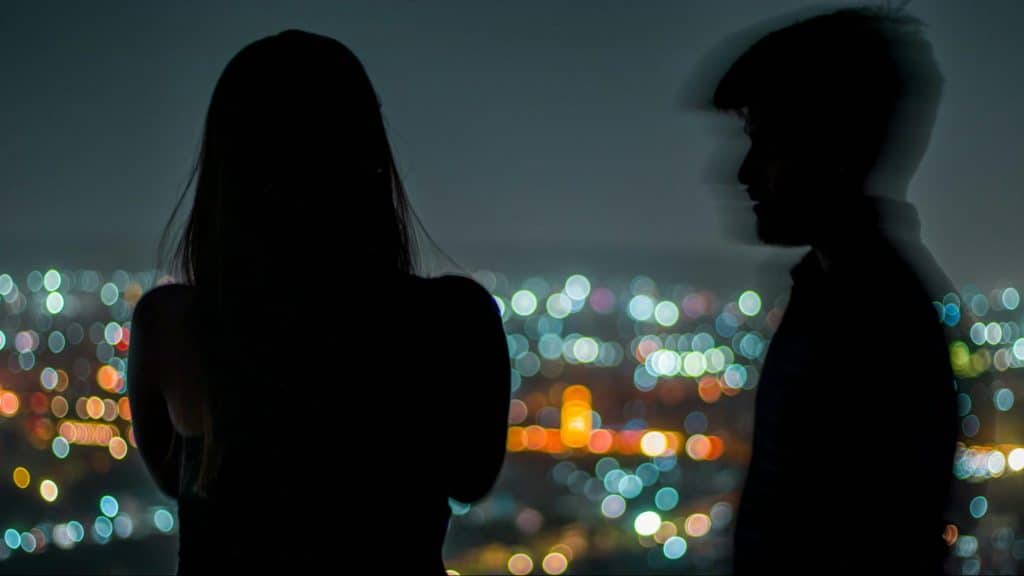 A man approaching woman