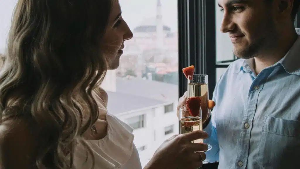 A couple holding glasses of champagne