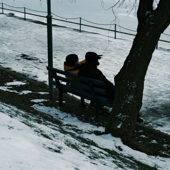 couple sitting together looking thoughtful