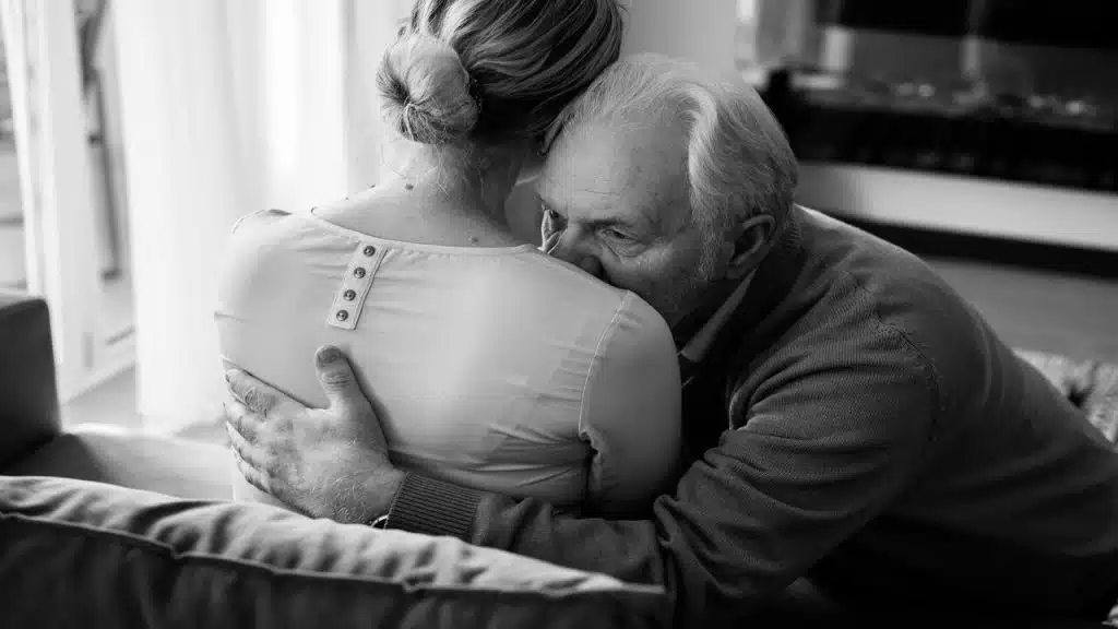 A man consoling his upset wife