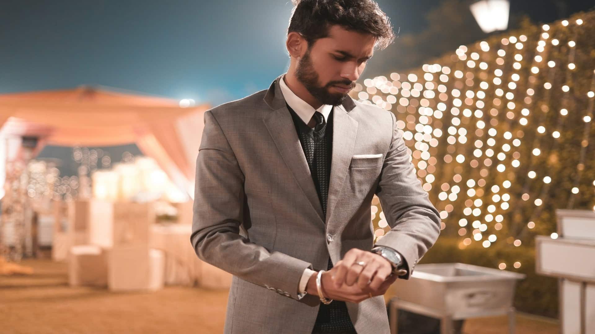 man adjusting jacket before date
