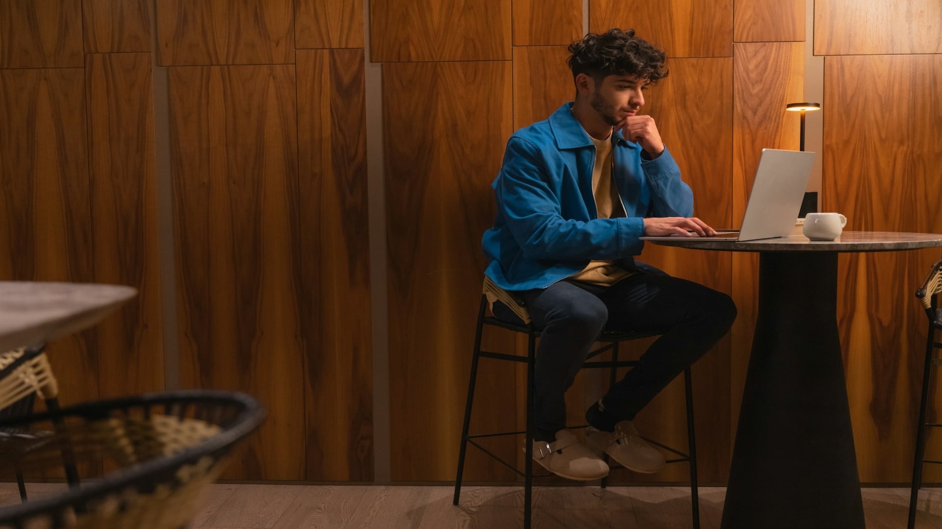 man sitting thoughtfully at desk