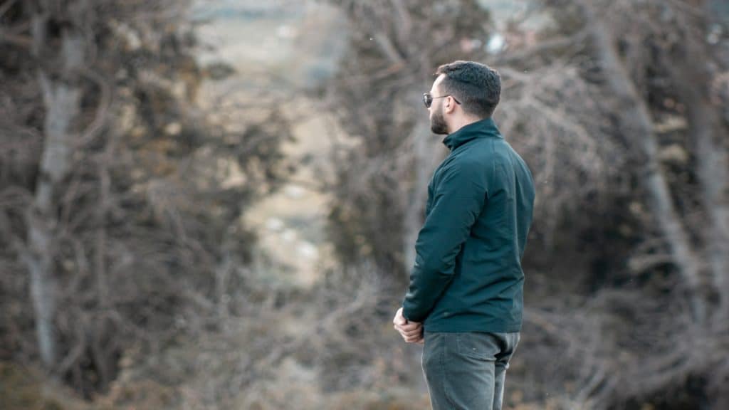 man reflecting outdoors