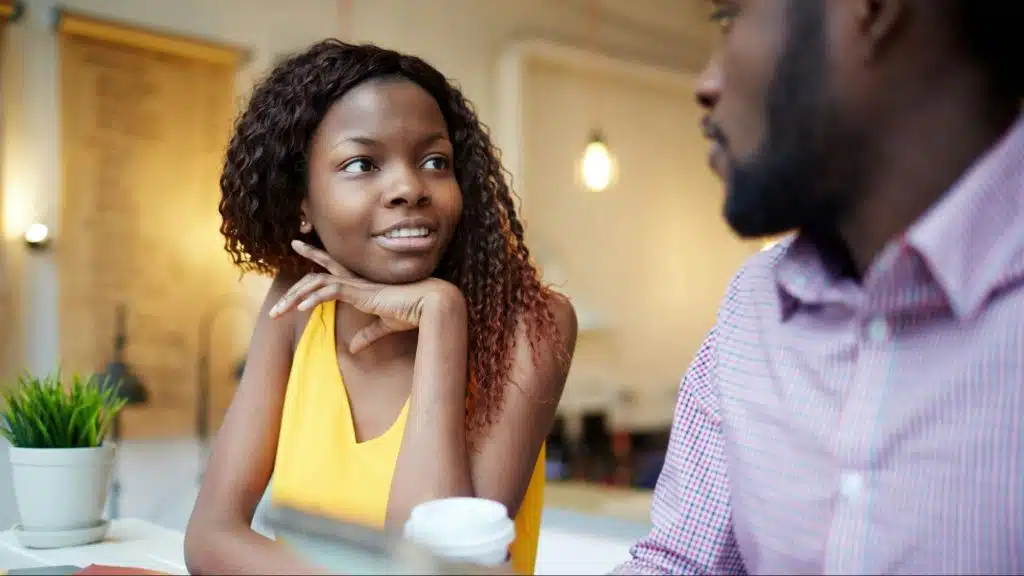 Woman smiling to a man