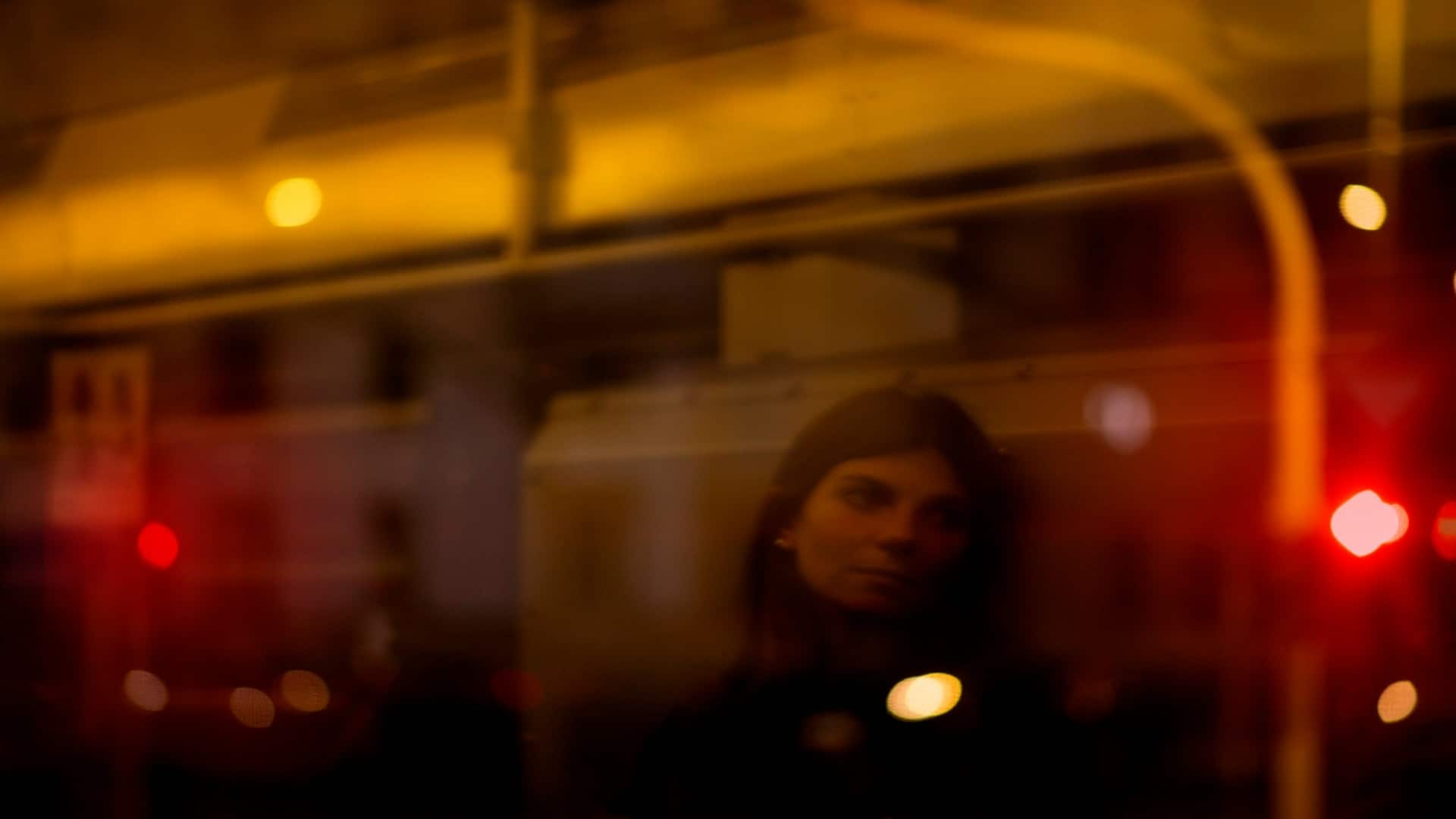 individual reflecting near window