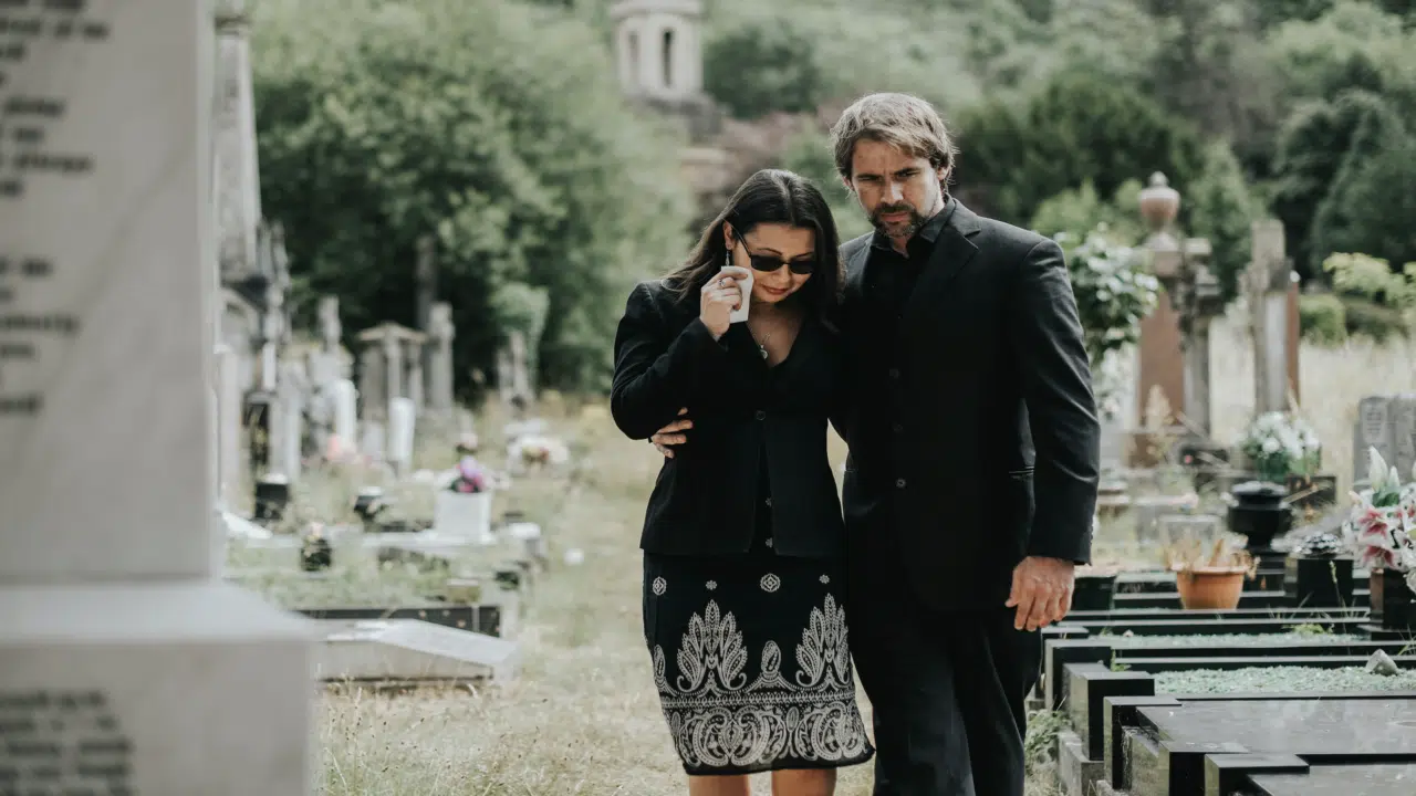A man supporting his wife through grief