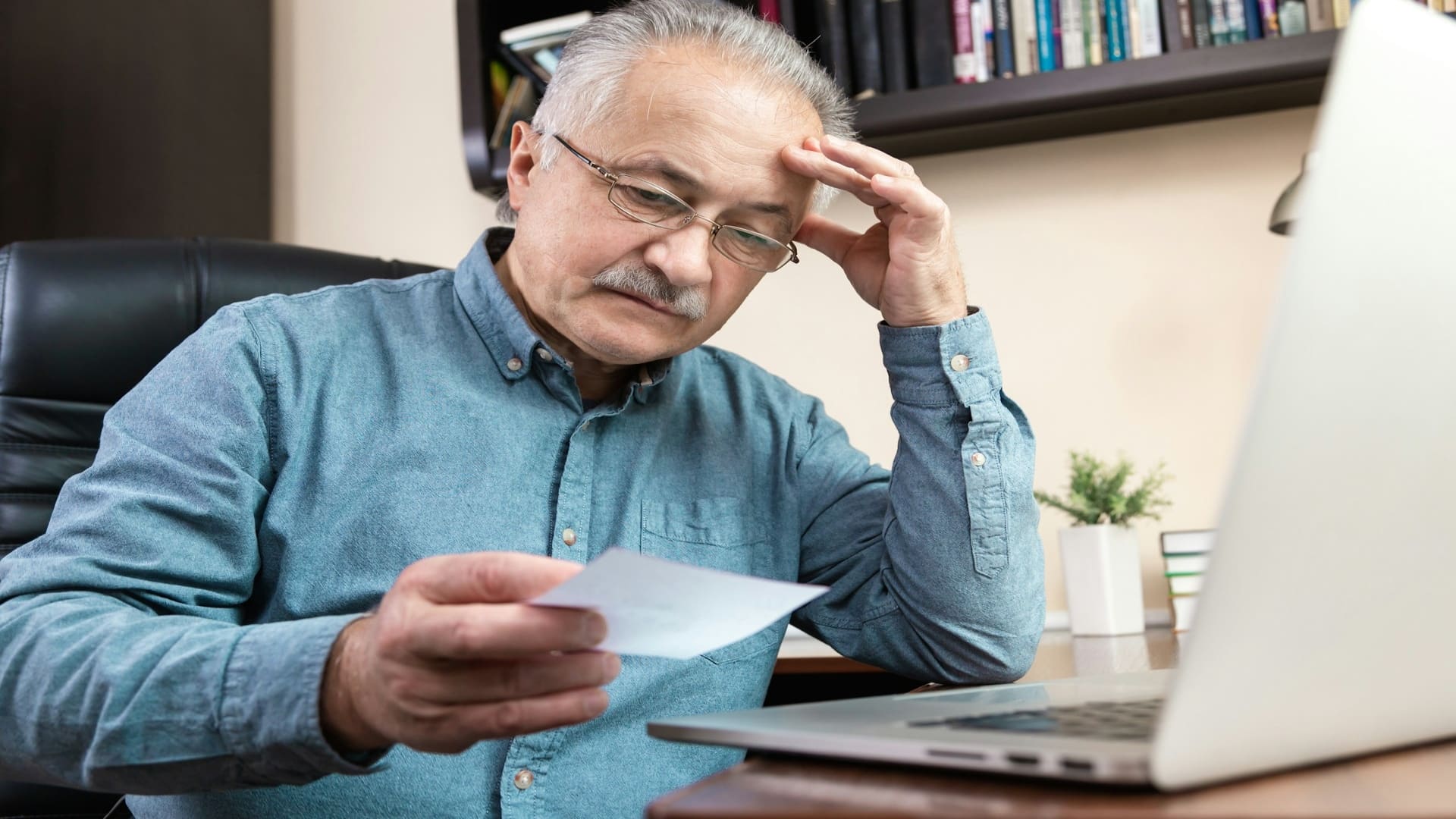 man reviewing financial documents
