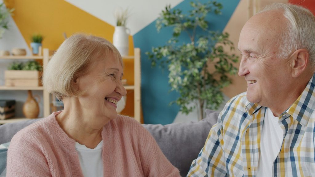 A couple smiling at each other