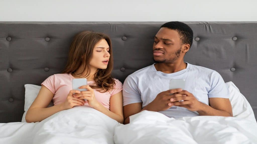 A young couple suspicious at each other