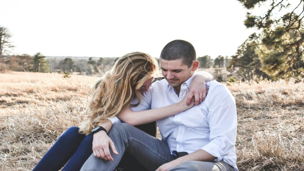 woman comforting partner during stressful moment