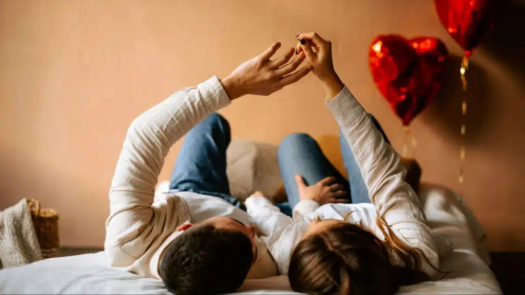 A man and woman touching hands