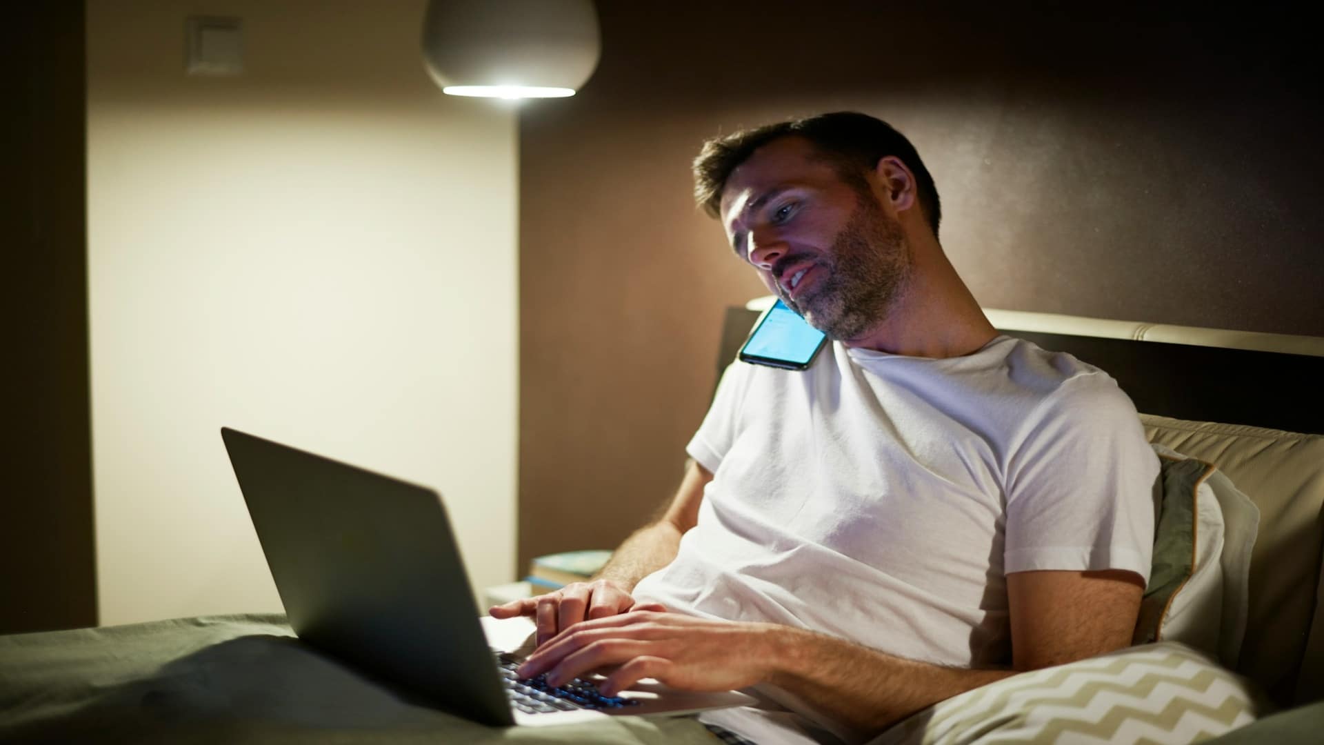 man working late on laptop