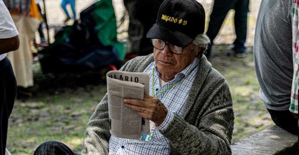man reading news