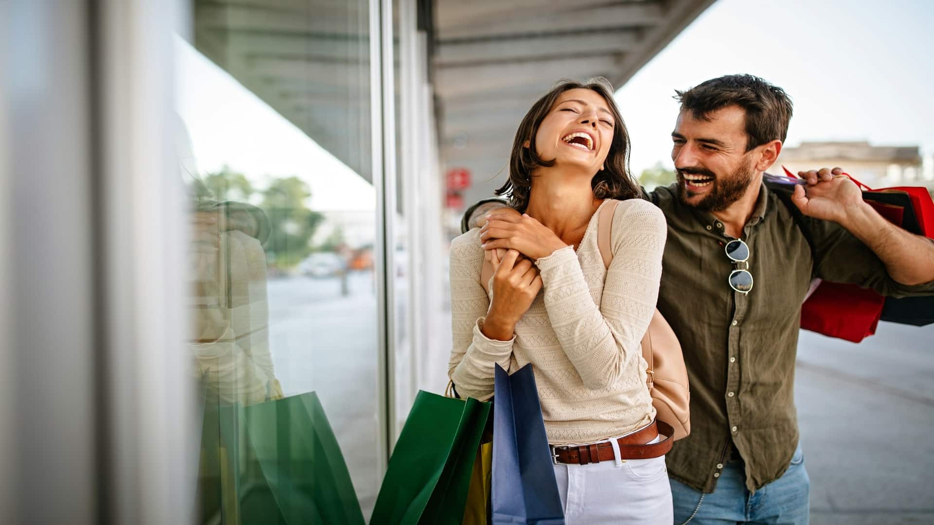 man helping partner carry bags