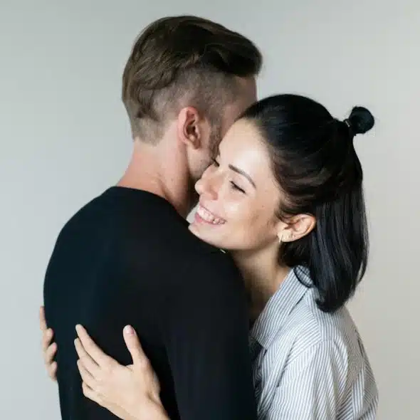 A couple hugging each other.