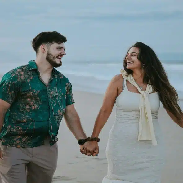 couple walking together smiling outdoors