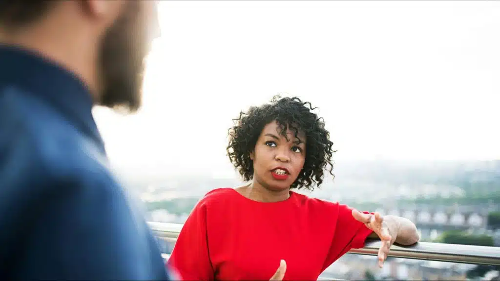 Woman talking to a man