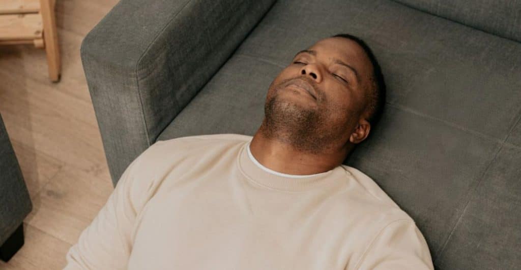 tired man sofa