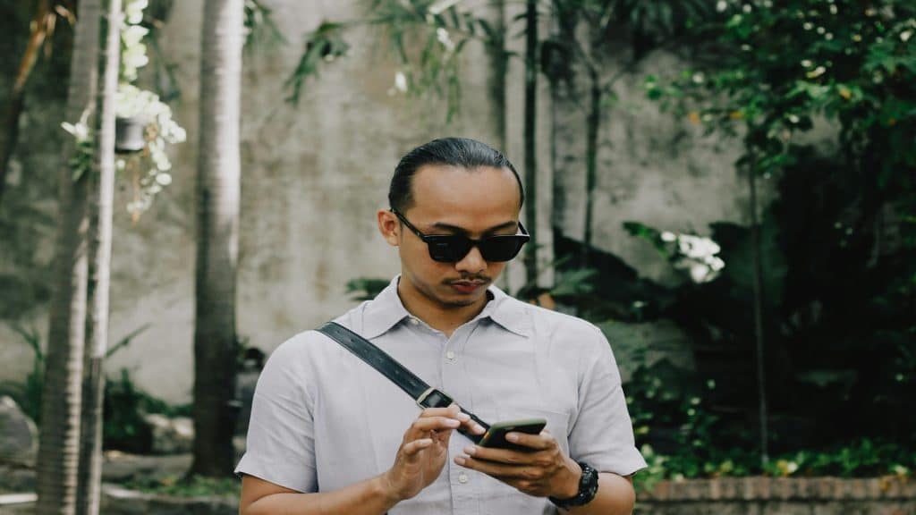 man checking phone