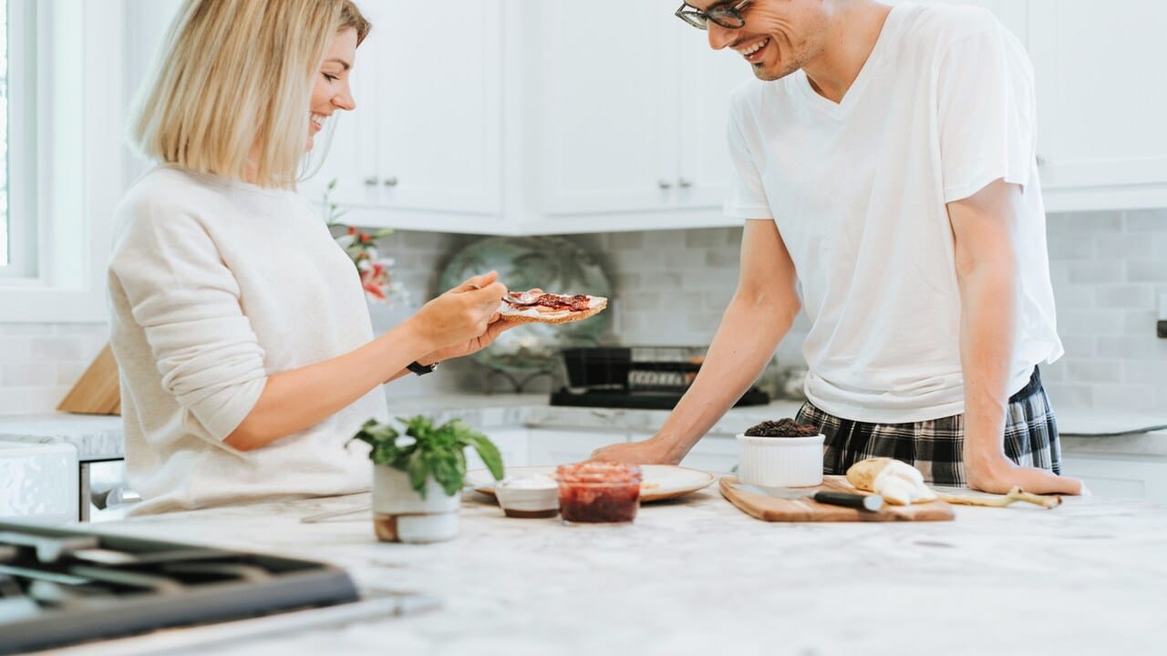 A woman making her husband a toast