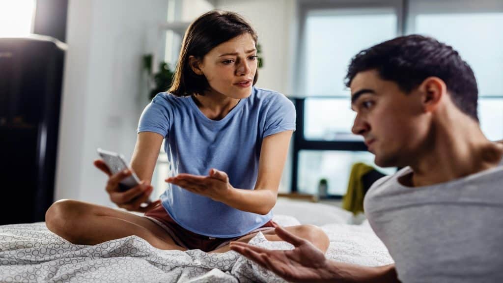 man speaking while partner is distracted