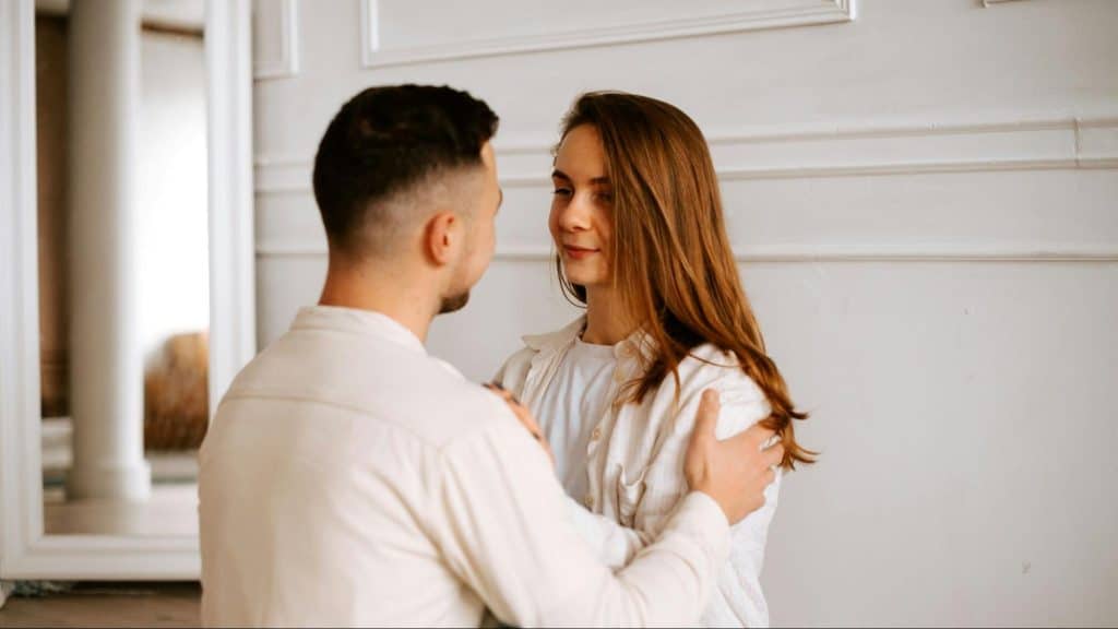A man and woman facing each other