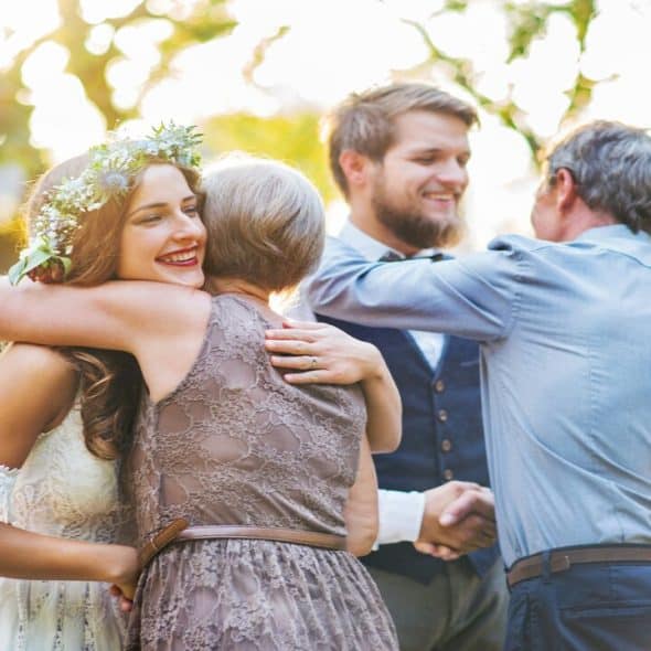 Parents greeting their kids at the latter’s wedding