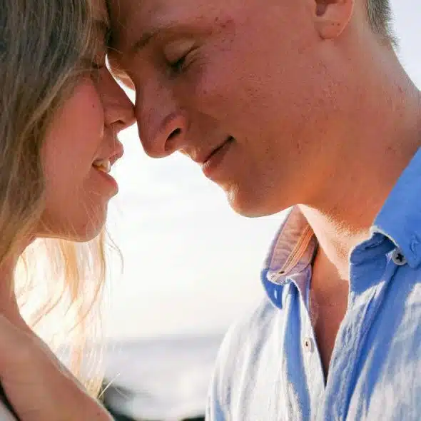 A couple touching foreheads